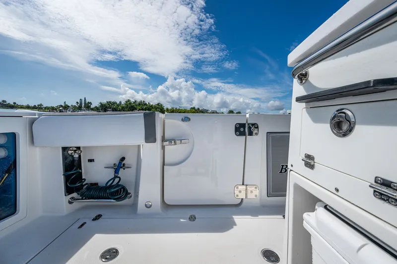 Aurora Yacht Photos Pics 2019 Blackfin 332 boat deck with storage compartments and clear blue sky.