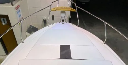 Ready For Immediate Delivery Yacht Photos Pics 2025 Hanover 305 Outboard Black & White T-Top Edition boat, viewed from the bow.