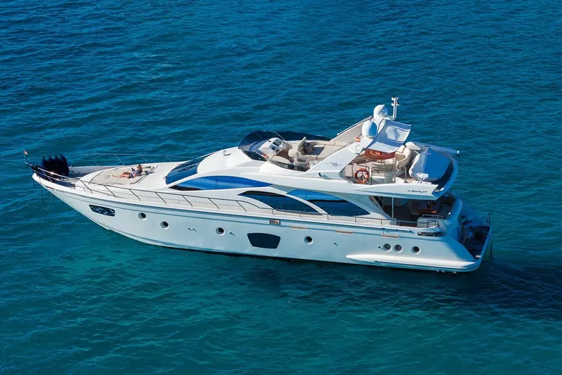 Exit Yacht Photos Pics Luxury 2008 Azimut 75 yacht cruising on clear blue ocean waters.