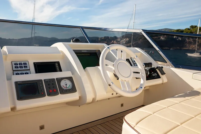 Exit Yacht Photos Pics Helm of 2008 Azimut 75 yacht with modern controls and steering wheel.