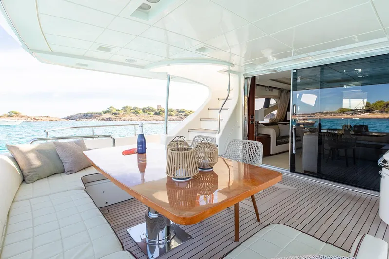 Exit Yacht Photos Pics Luxurious 2008 Azimut 75 yacht deck with elegant seating and scenic ocean view.