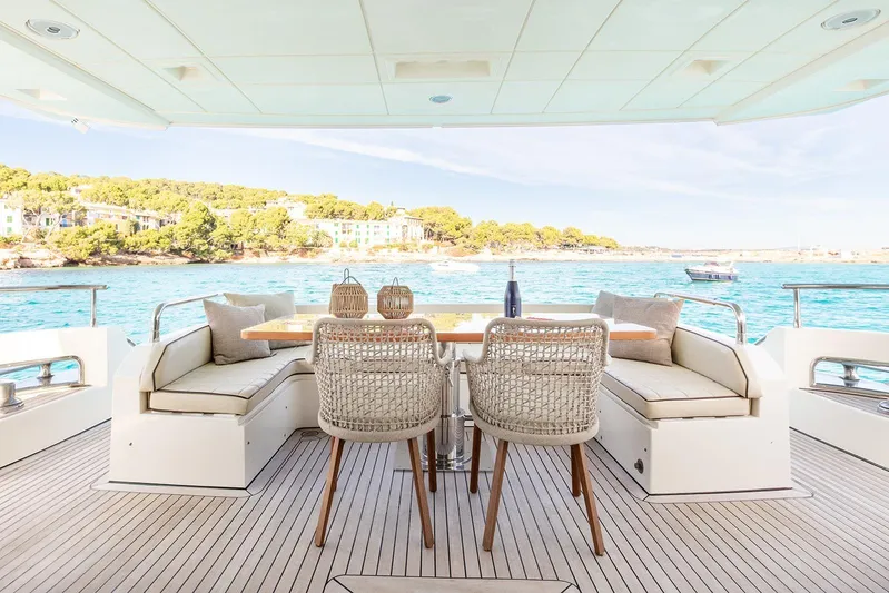 Exit Yacht Photos Pics Luxurious 2008 Azimut 75 yacht deck with elegant seating and scenic ocean view.