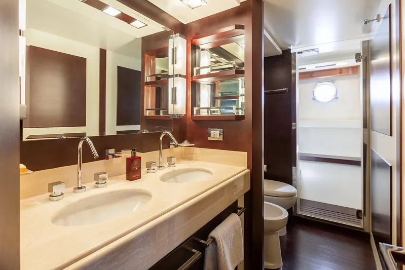 Exit Yacht Photos Pics Luxurious bathroom in 2008 Azimut 75 yacht with double sinks and modern fixtures.