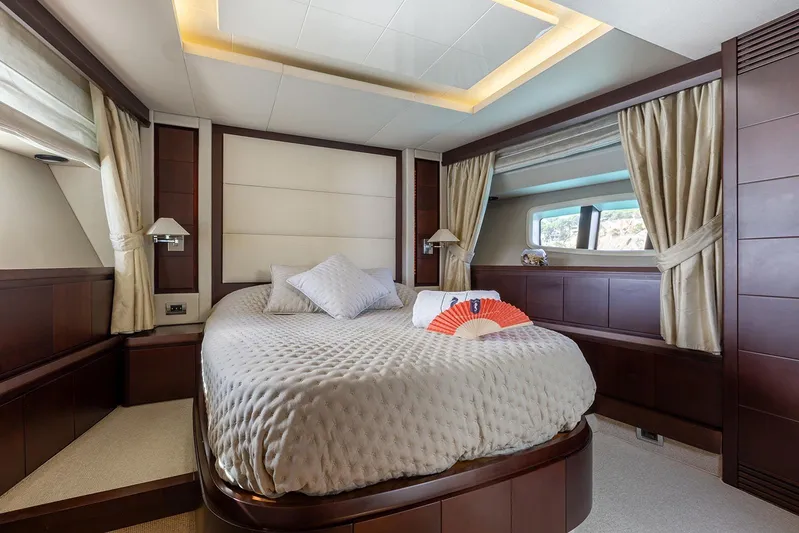 Exit Yacht Photos Pics Luxurious bedroom interior of 2008 Azimut 75 yacht with elegant decor and natural light.