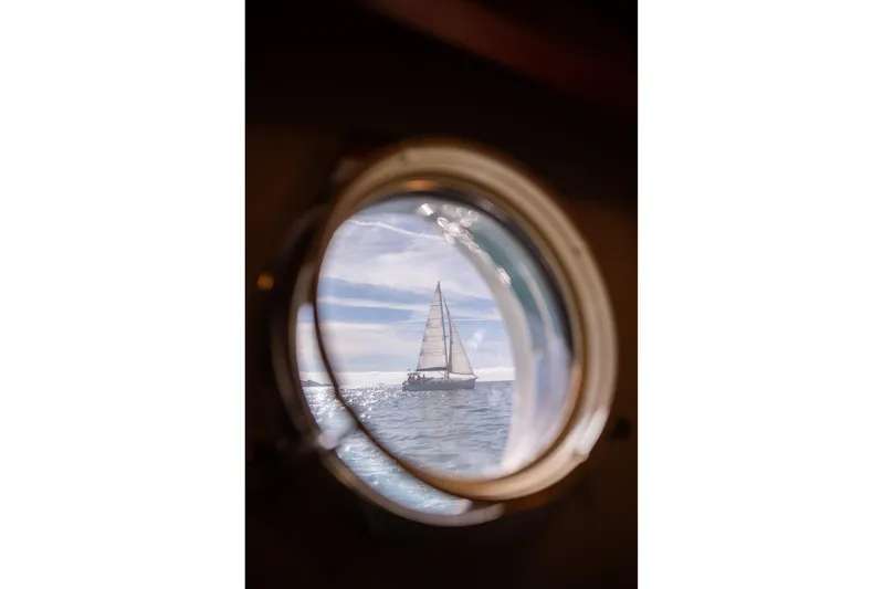 Exit Yacht Photos Pics View of sailboat through porthole on 2008 Azimut 75 yacht.