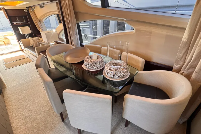 Exit Yacht Photos Pics Luxurious interior of 2008 Azimut 75 yacht with elegant dining area and modern decor.
