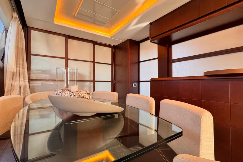 Exit Yacht Photos Pics Luxurious interior of 2008 Azimut 75 yacht with elegant dining area and modern decor.