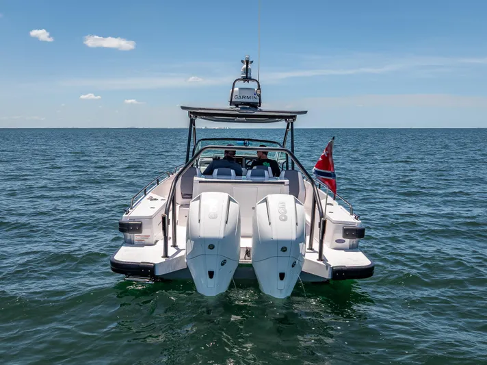  Yacht Photos Pics 2022 Axopar 28 T-Top Brabus boat on open water, rear view.