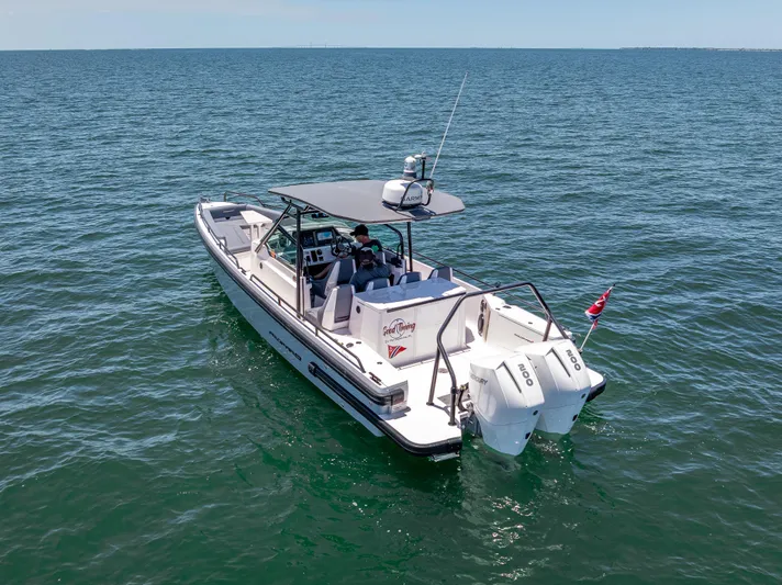  Yacht Photos Pics 2022 Axopar 28 T-Top Brabus boat cruising on open water.