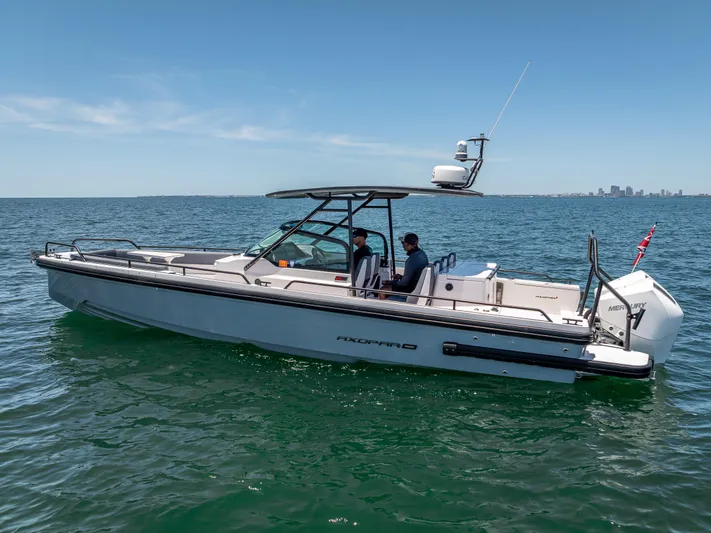  Yacht Photos Pics 2022 Axopar 28 T-Top Brabus boat cruising on open water.