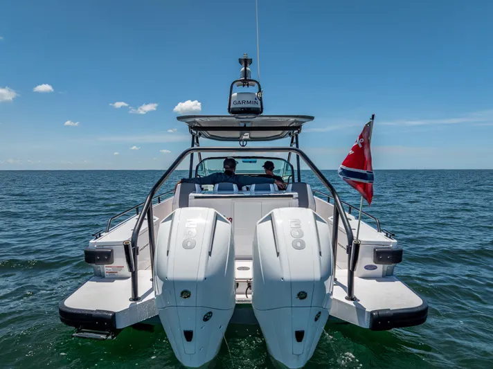  Yacht Photos Pics 2022 Axopar 28 T-Top Brabus on open water, rear view with dual engines.