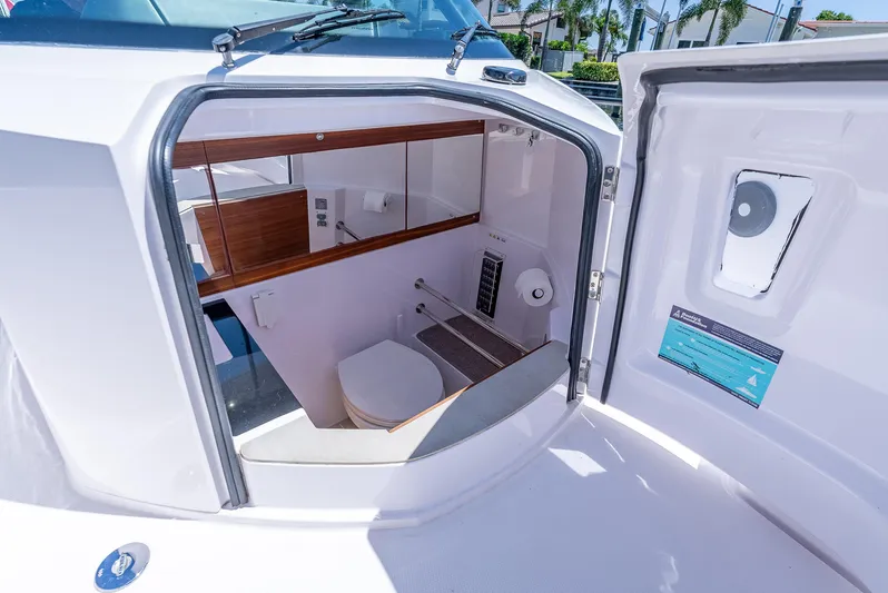  Yacht Photos Pics Interior view of 2022 Axopar 28 T-Top Brabus boat's compact bathroom.