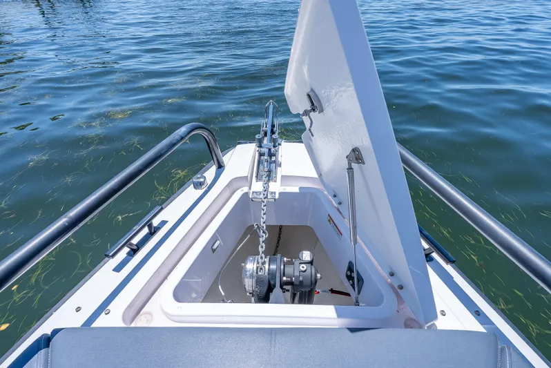  Yacht Photos Pics Anchor compartment of 2022 Axopar 28 T-Top Brabus on water.