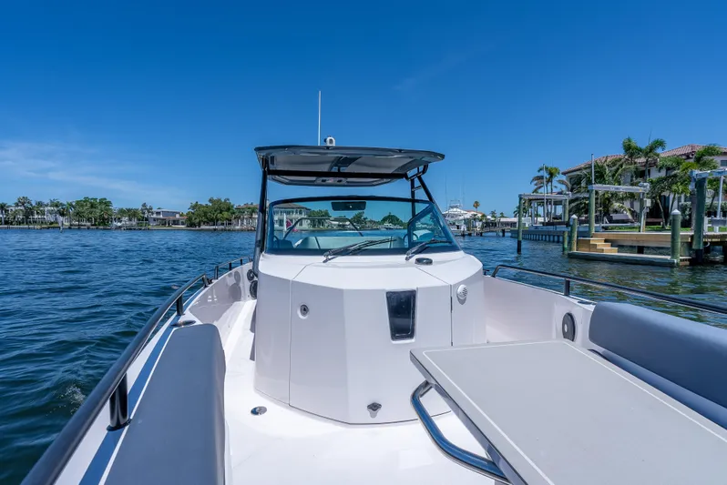  Yacht Photos Pics 2022 Axopar 28 T-Top Brabus on water, showcasing sleek design and spacious deck.