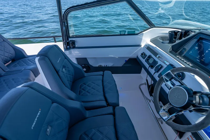  Yacht Photos Pics Interior of 2022 Axopar 28 T-Top Brabus boat with modern dashboard and seating.