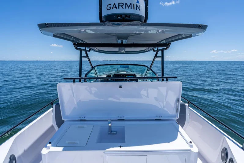  Yacht Photos Pics 2022 Axopar 28 T-Top Brabus boat on open water, featuring Garmin equipment.