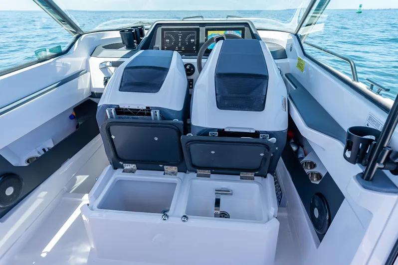  Yacht Photos Pics 2022 Axopar 28 T-Top Brabus boat interior with dual seats and dashboard view.