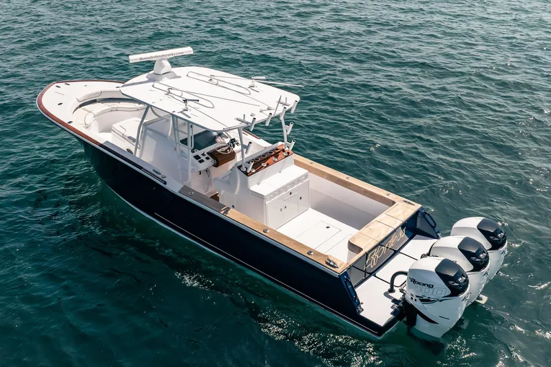 Effortless Yacht Photos Pics 2018 Bonadeo 37 WACC boat on open water, featuring triple outboard engines.