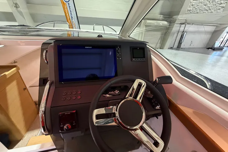  Yacht Photos Pics 2025 Nimbus Weekender 9 boat dashboard with modern steering and navigation display.