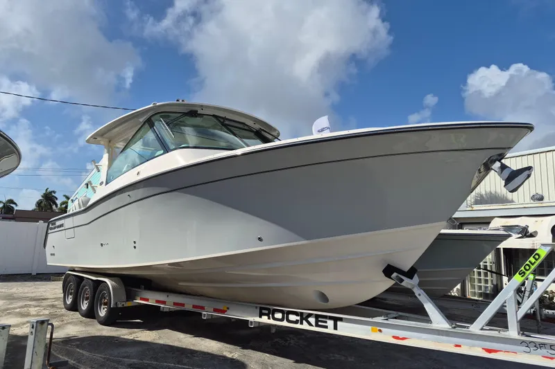 345-624 Yacht Photos Pics 2026 Grady-White Freedom 345 boat on trailer under blue sky.