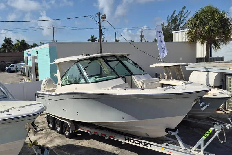 345-624 Yacht Photos Pics 2026 Grady-White Freedom 345 boat on trailer, outdoor dealership display.