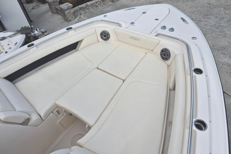 345-624 Yacht Photos Pics 2026 Grady-White Freedom 345 boat interior with spacious white seating and speakers.