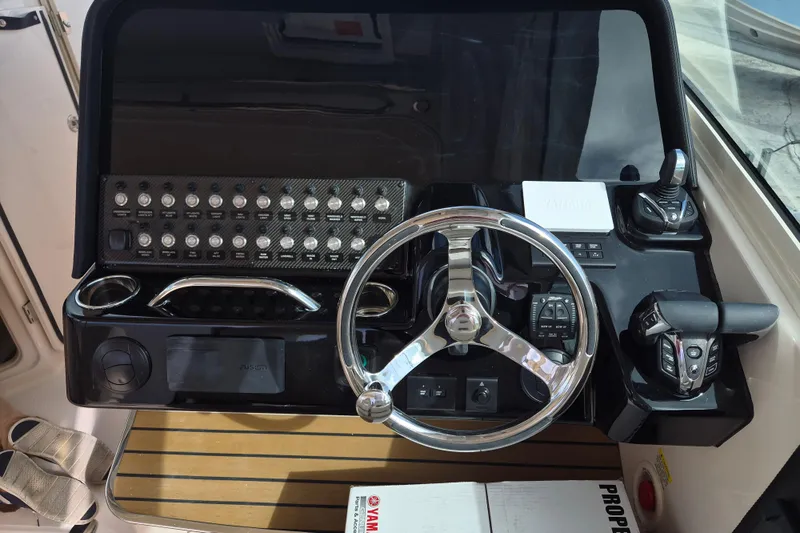 345-624 Yacht Photos Pics 2026 Grady-White Freedom 345 helm with steering wheel and control panel.