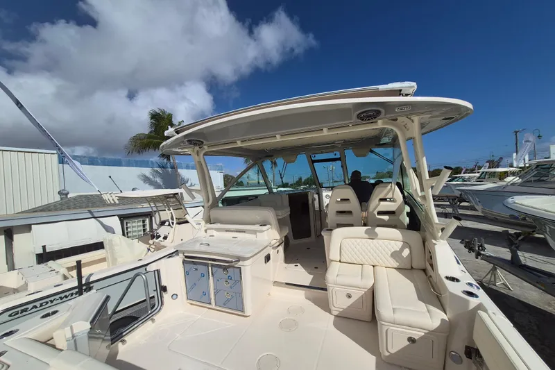 345-624 Yacht Photos Pics 2026 Grady-White Freedom 345 boat with spacious seating and modern design under clear blue sky.