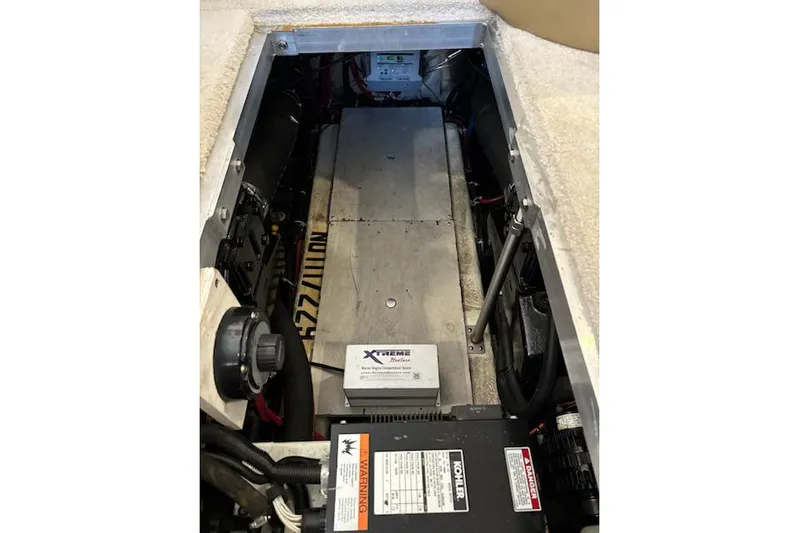  Yacht Photos Pics Engine compartment of 2001 Carver 356 Motor Yacht, featuring mechanical components and wiring.