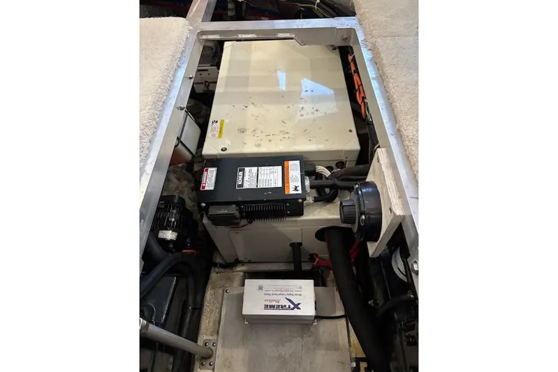  Yacht Photos Pics Engine compartment of a 2001 Carver 356 Motor Yacht, showcasing mechanical components.