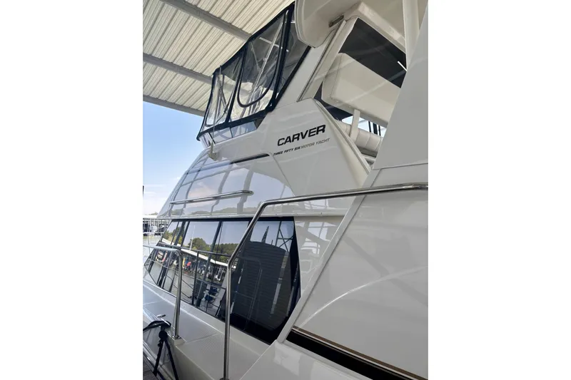  Yacht Photos Pics 2001 Carver 356 Motor Yacht with sleek design under a covered dock.