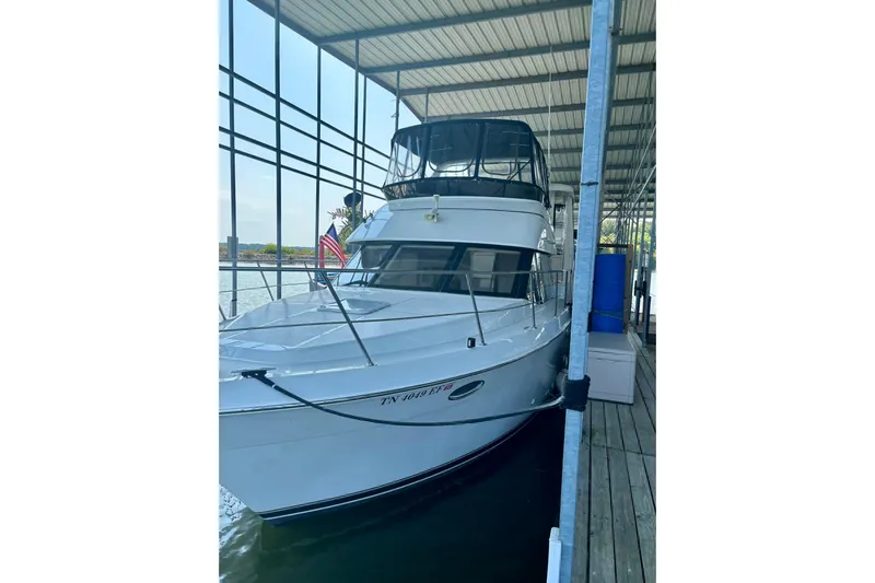  Yacht Photos Pics 2001 Carver 356 Motor Yacht docked in a covered marina.