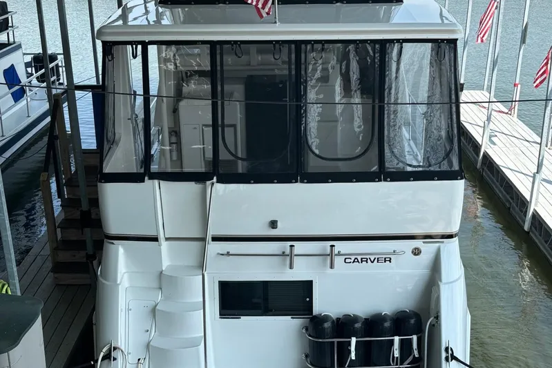  Yacht Photos Pics 2001 Carver 356 Motor Yacht docked, rear view with American flags.