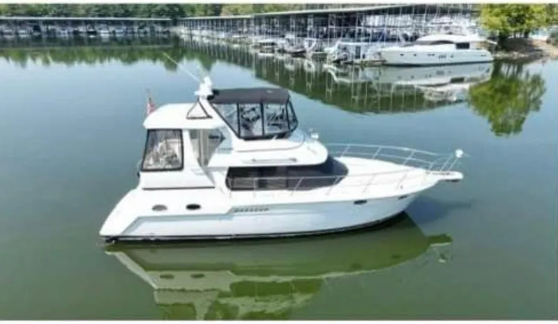  Yacht Photos Pics 2001 Carver 356 Motor Yacht on calm water near marina.