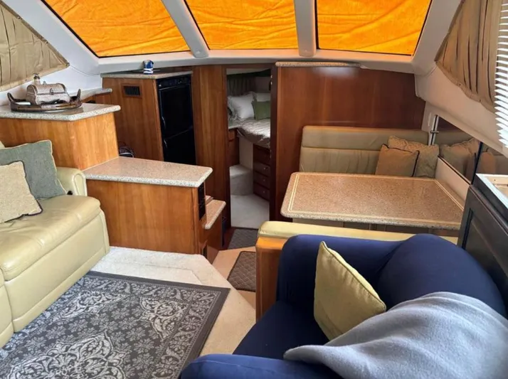  Yacht Photos Pics Interior of 2001 Carver 356 Motor Yacht with cozy seating and dining area.