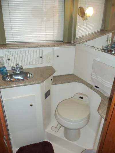  Yacht Photos Pics Bathroom interior of 2001 Carver 356 Motor Yacht with sink and toilet.