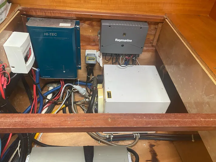 Plan B Yacht Photos Pics Electrical components inside a 2002 Lagoon 380 boat, featuring Raymarine and Hi-Tec equipment.