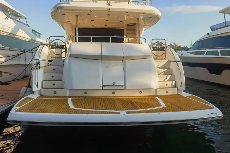  Yacht Photos Pics Sunseeker 88 Yacht 2011, rear view, docked at marina with wooden deck.