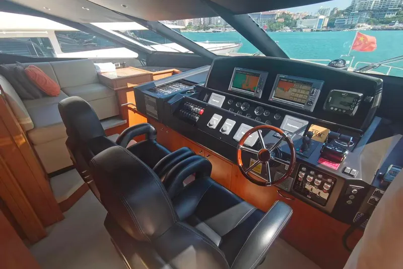  Yacht Photos Pics Luxurious 2011 Sunseeker 88 Yacht helm with modern navigation equipment and plush seating.