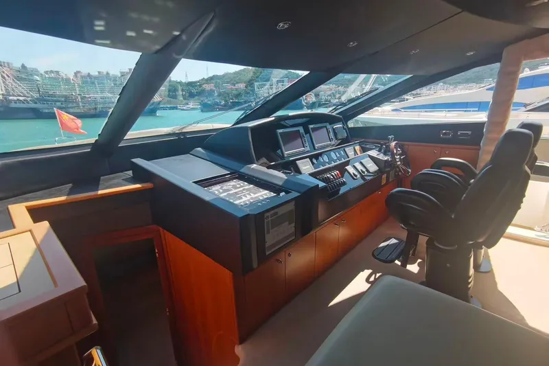  Yacht Photos Pics Luxurious 2011 Sunseeker 88 Yacht helm with modern navigation equipment and panoramic views.