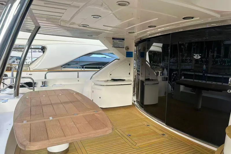  Yacht Photos Pics Luxurious 2011 Sunseeker 88 Yacht interior with wooden deck and sleek design.