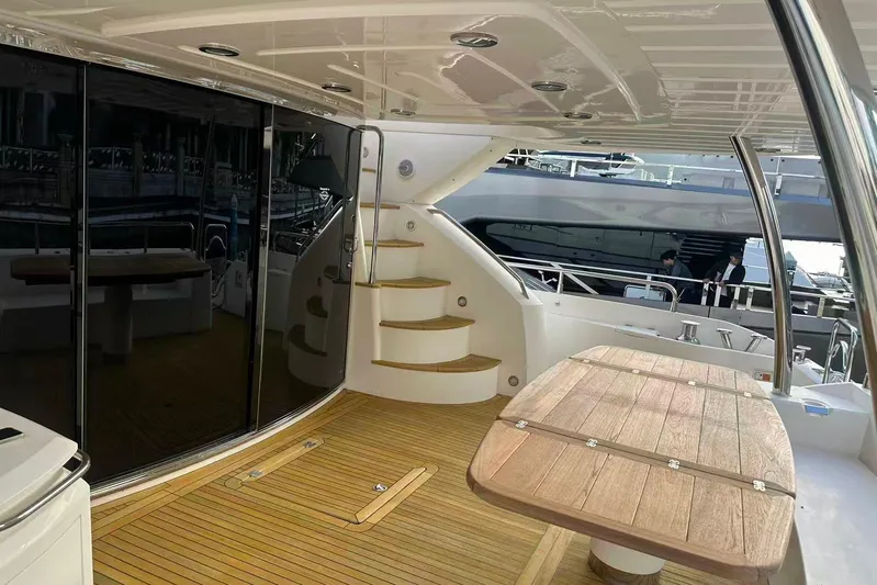  Yacht Photos Pics Luxurious 2011 Sunseeker 88 Yacht deck with wooden flooring and elegant staircase.