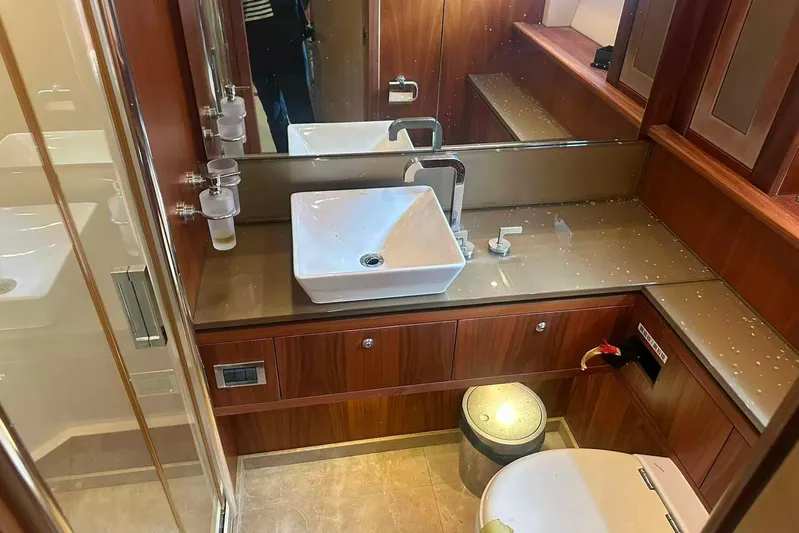  Yacht Photos Pics Luxurious bathroom in 2011 Sunseeker 88 Yacht with modern sink and wood accents.