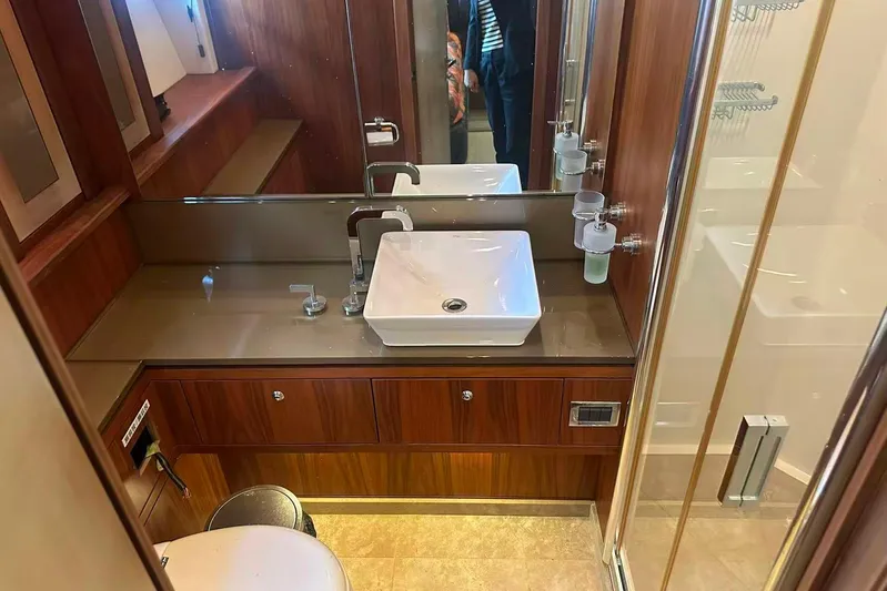  Yacht Photos Pics Luxurious bathroom in a 2011 Sunseeker 88 Yacht with modern sink and shower.