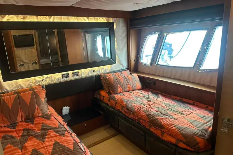  Yacht Photos Pics Luxurious cabin interior of 2011 Sunseeker 88 Yacht with twin beds and large windows.