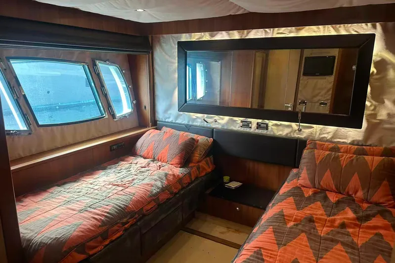  Yacht Photos Pics Luxurious cabin interior of 2011 Sunseeker 88 Yacht with twin beds and large window.