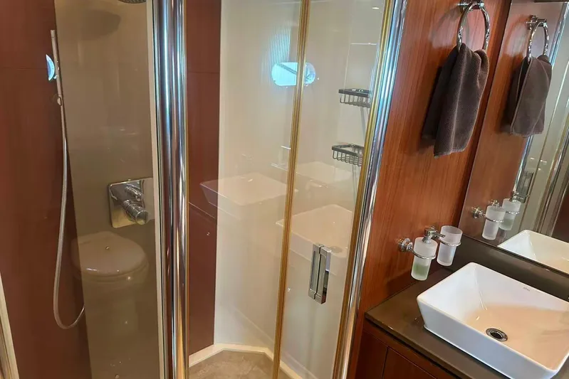 Yacht Photos Pics Luxurious bathroom in 2011 Sunseeker 88 Yacht with modern fixtures and elegant design.
