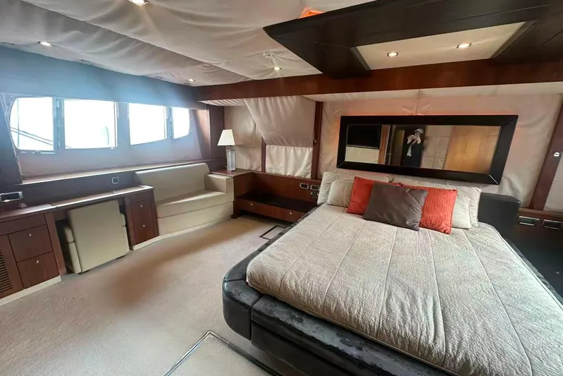  Yacht Photos Pics Luxurious bedroom interior of 2011 Sunseeker 88 Yacht with elegant furnishings.