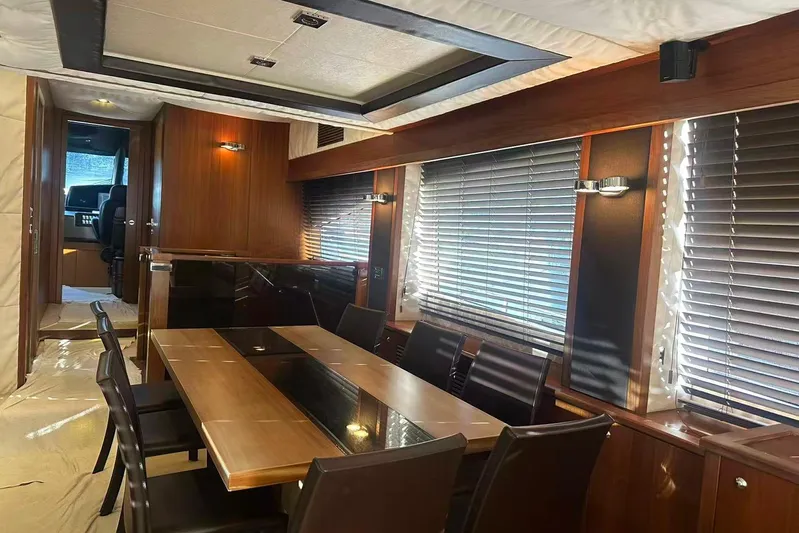  Yacht Photos Pics Luxurious dining area inside a 2011 Sunseeker 88 Yacht, featuring elegant wood finishes.