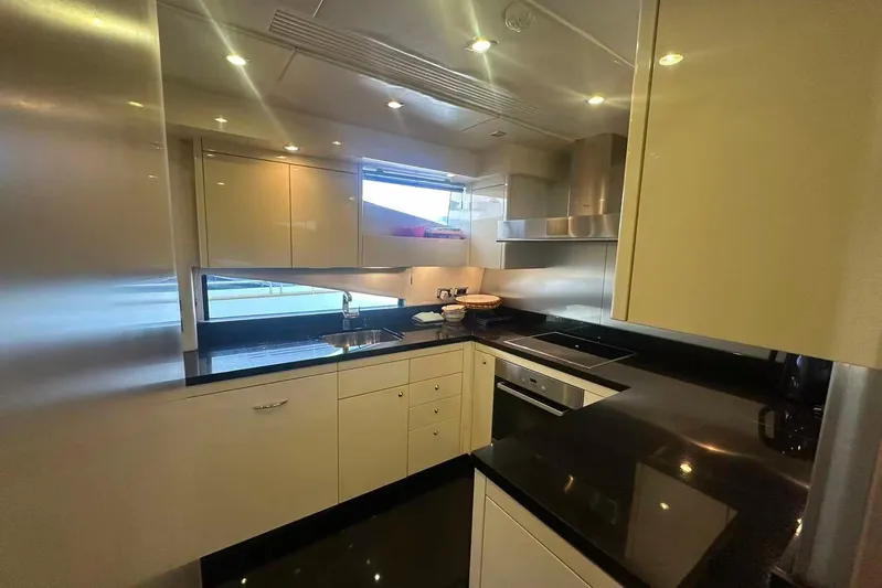  Yacht Photos Pics Luxurious kitchen interior of 2011 Sunseeker 88 Yacht with modern appliances and sleek design.